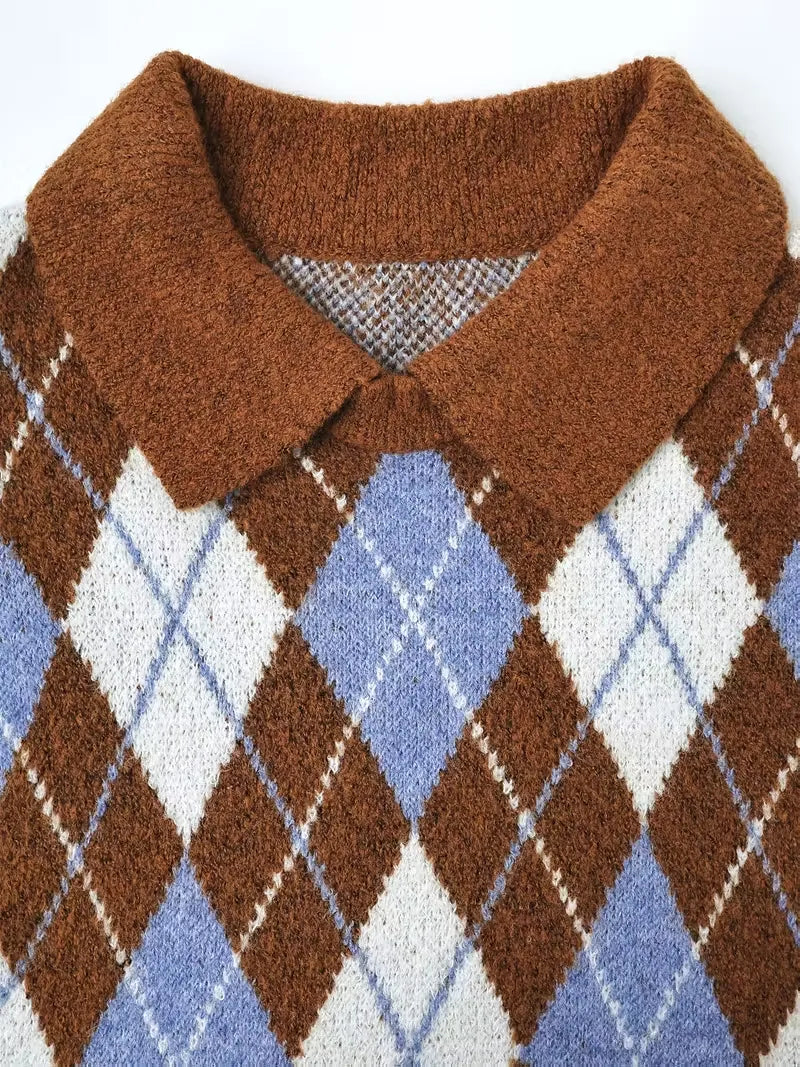 Close-up of a brown argyle patterned sweater collar on a white background