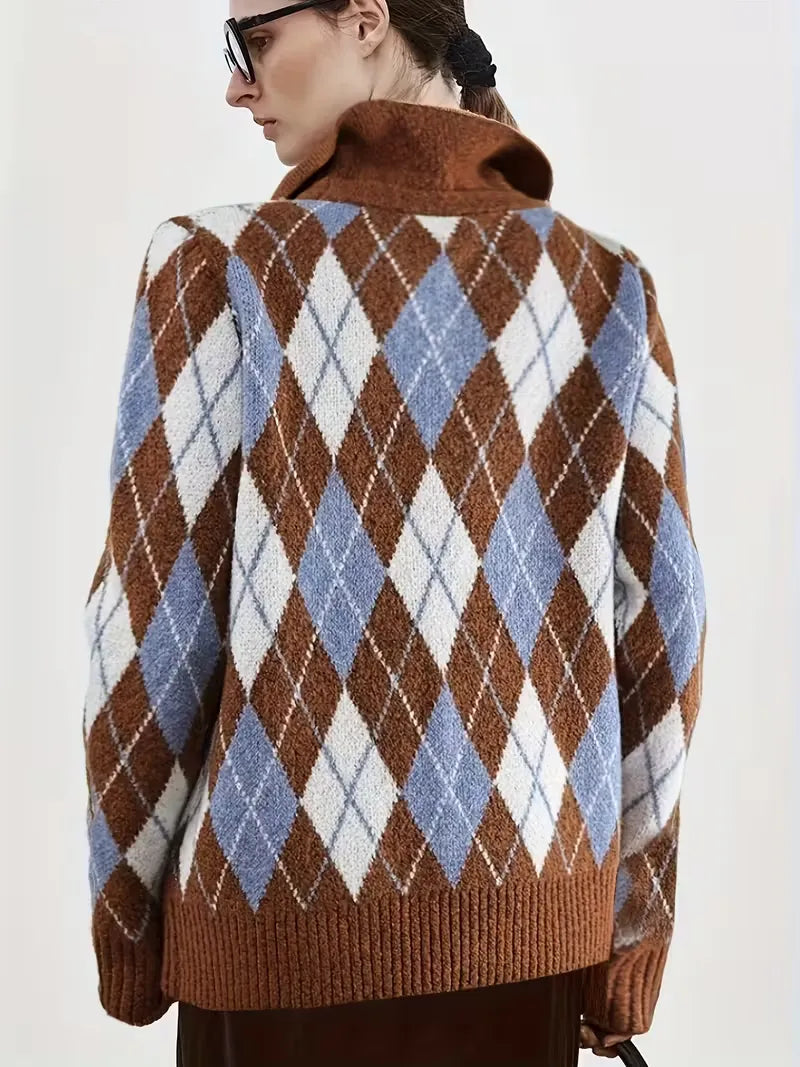 Person wearing a brown argyle sweater with a white background