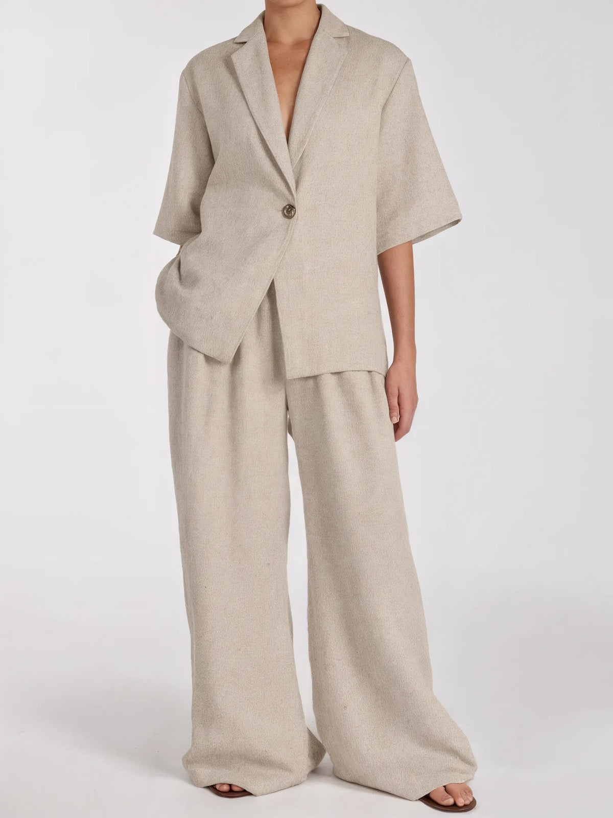 Beige suit with wide-leg pants on a white background