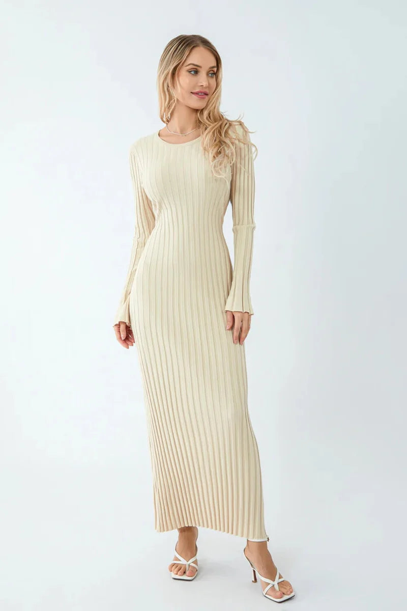 Woman wearing a beige ribbed dress on a white background