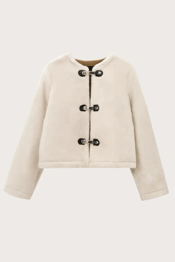 Beige jacket with button details on a white background