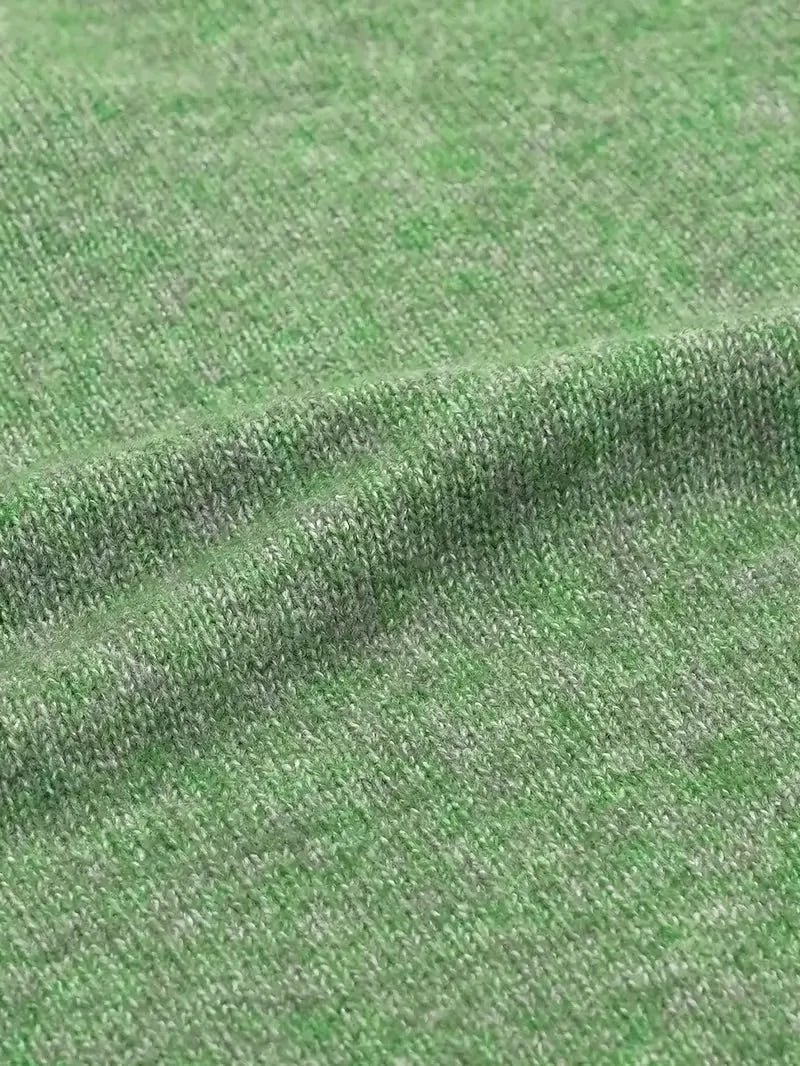 Close-up of green fabric with a textured pattern