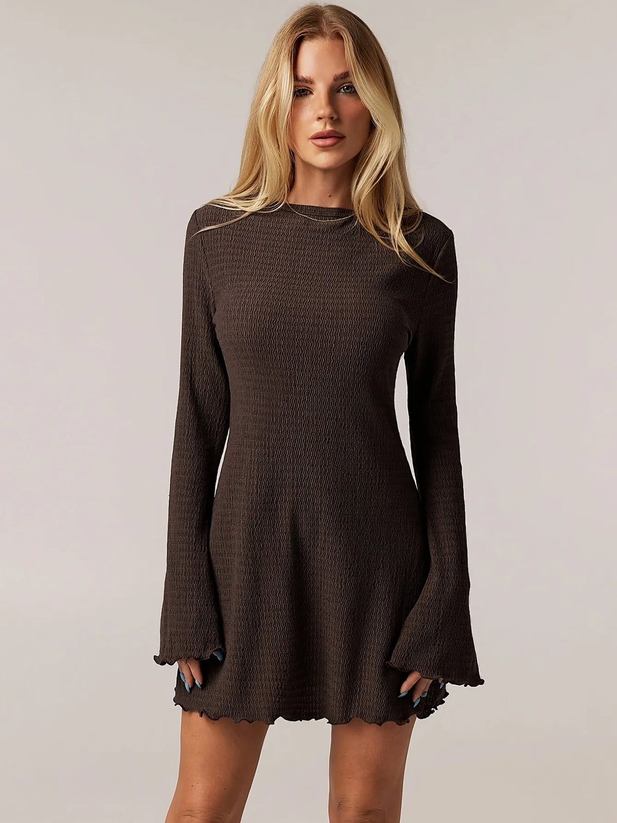 brown ribbed knit long-sleeve mini dress with flared sleeves and round neckline, fitted through the torso, casual yet elegant style