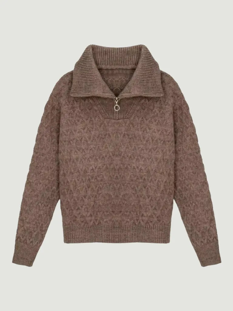 Brown patterned sweater on a light gray background